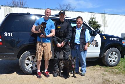 Osceola County, Michigan Sheriff's Department Deputy Jed Avery and Deputy Mark Moore with their future PSD K9 Dutch Shepherd puppies and breeder Cheryl Carlson of Cher Car Kennels.